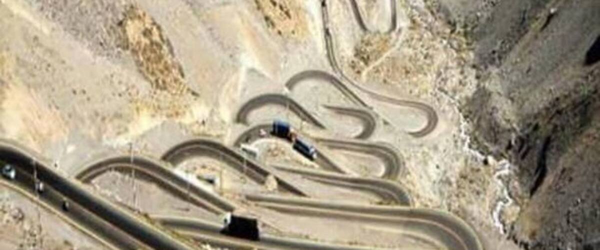 A winding road through a rocky canyon.