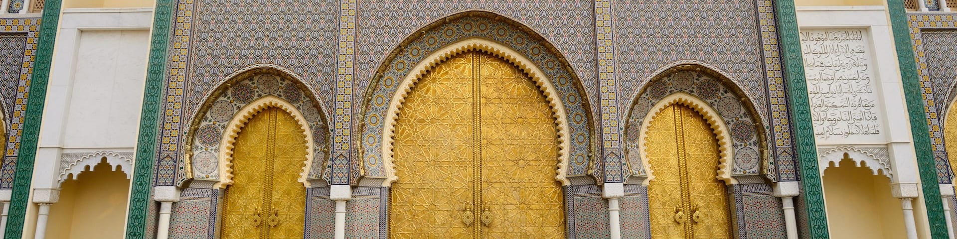 Brass doors to the Dar El Makhzen the Kings Royal Palace with intricate Zellige tilework in Fes Morocco