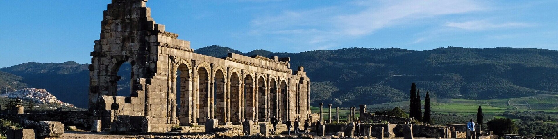 Grab the grand taxi from Meknes to Moulay Idriss. Then again, take another taxi from Moulay Idriss to Volubilis. It doesn't cost much if you can find fellow tourist to share the cab or you'll be paying for 6 seats.
I actually tried to walk 4 km from Moulay Idriss. I ended up hitchhiking after half way.