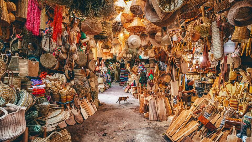 A market with various woven baskets and wooden items.