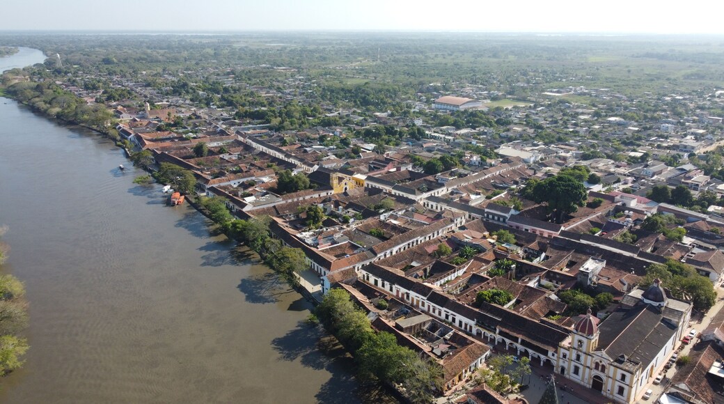 Aerial view of the historic city of Santa Cruz de Mompox in sunlight with the river and the Iglesia de Santa Bárbara (Church of San Bárbara) Colombia, a World Heritage Site