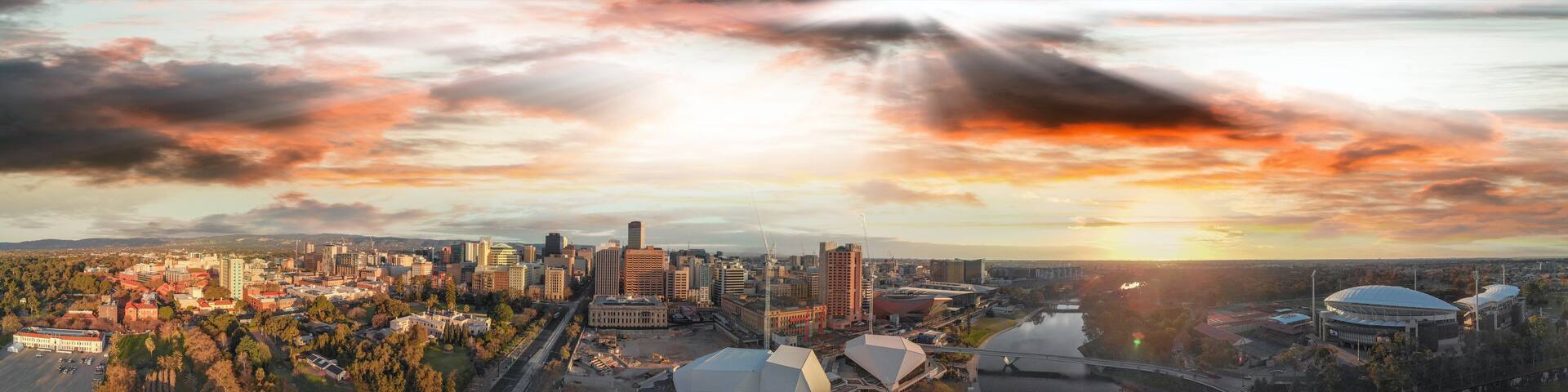 Stunning aerial panoramic view of Adelaide skyline at sunset, South Australia