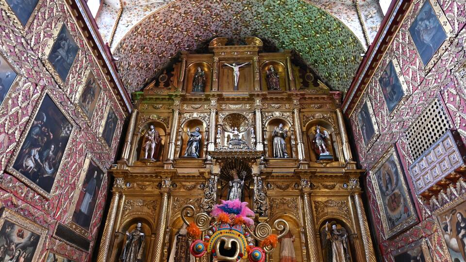 An ornate religious altar with intricate carvings and statues.