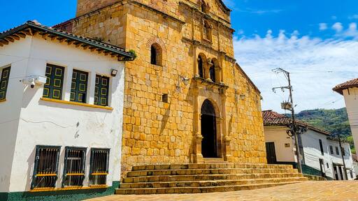 Historic Church in Oiba, Santander, Colombia with Blue Sky Background