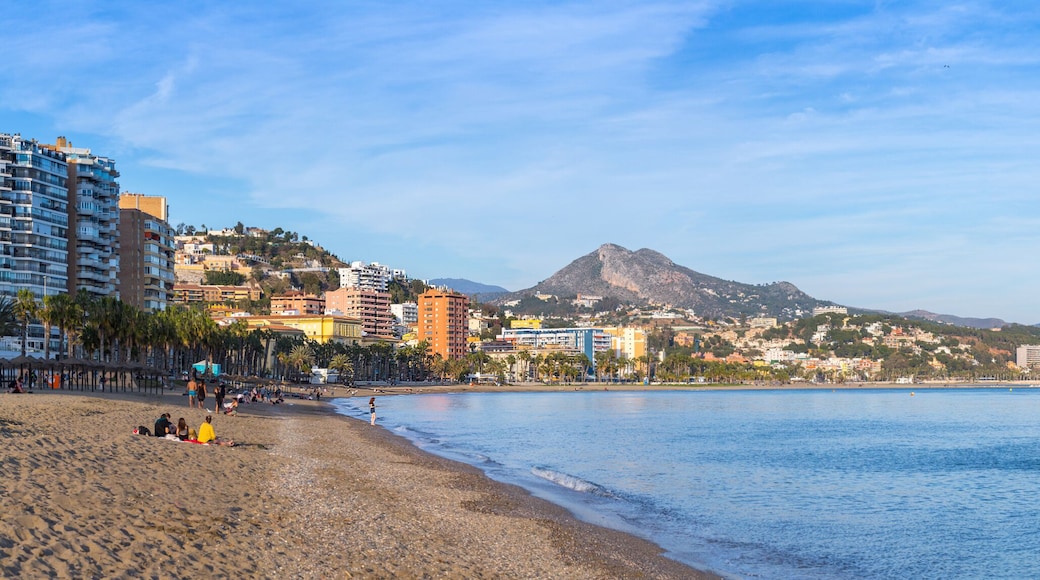 Breathtaking romantic summer panoramic view of Malagueta beach (Playa la Malagueta) in soft evening sunlight. Costa del Sol. Malaga. Andalusia. Spain.
