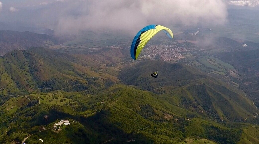 Flying high above Roldenillo, Colombia.
The city is in the distance under the clouds. A great place to visit in central Colombia.