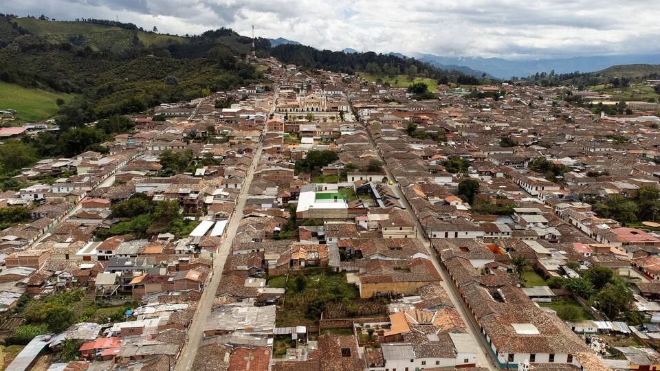 A densely packed urban area with a prominent church and surrounding residential buildings.