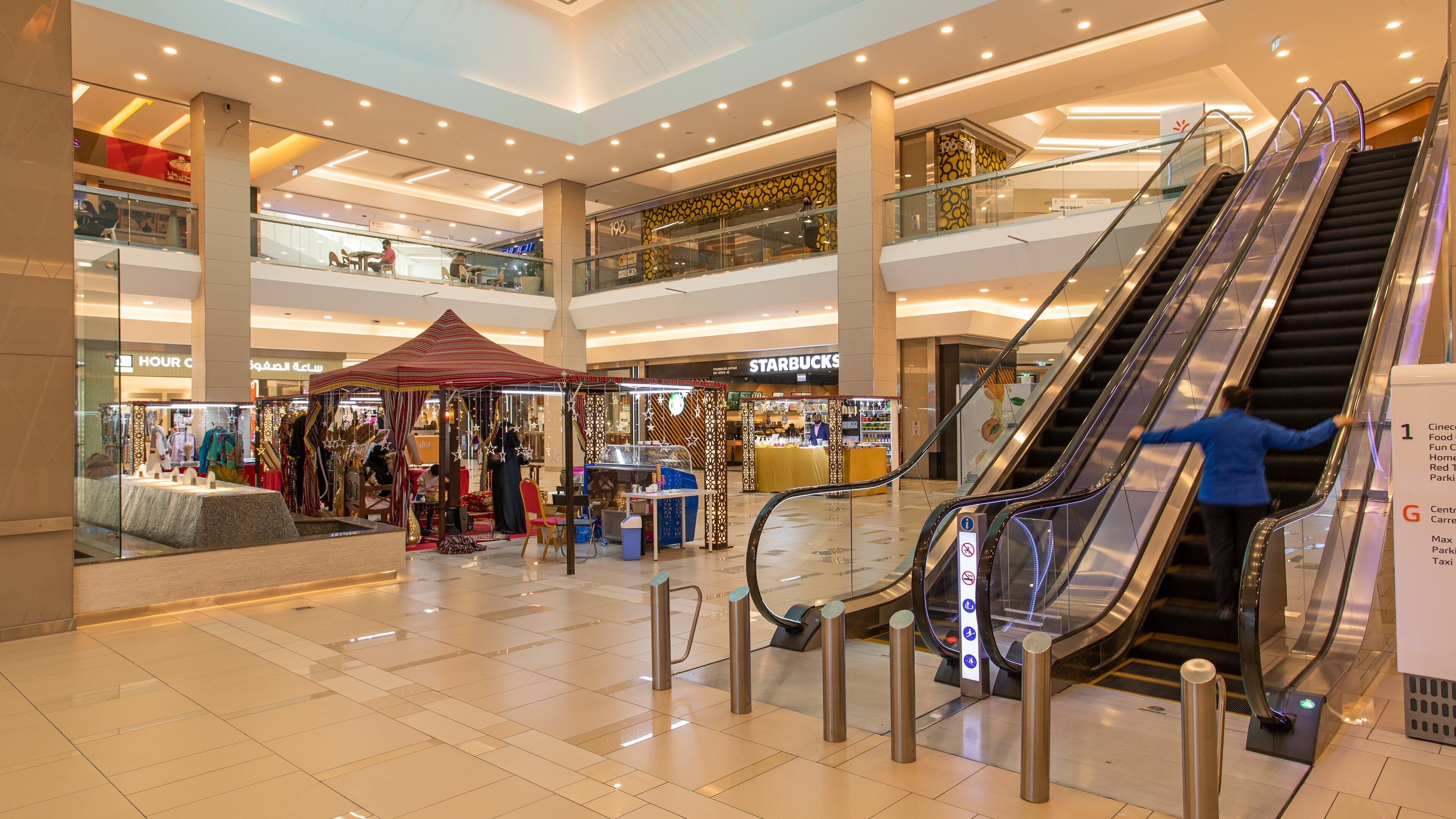 Oasis Center Juffair featuring shopping and interior views
