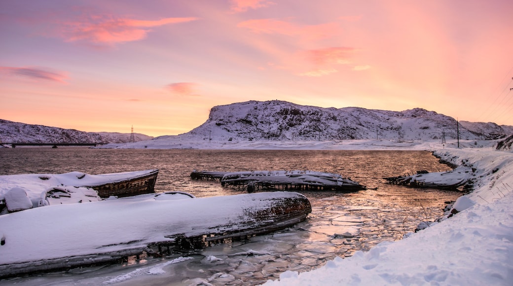Sunken ships near the snowy coast in Teriberka, Murmansk Region, Russia