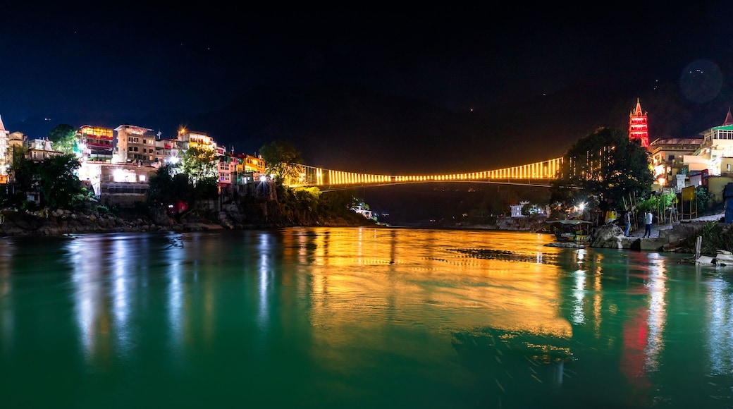 Spectacular illuminated panoramic cityscape of Rishikesh, the yoga capital of World located in foothills Himalayas along banks of river Ganga or Ganges in Uttarakhand state of India.