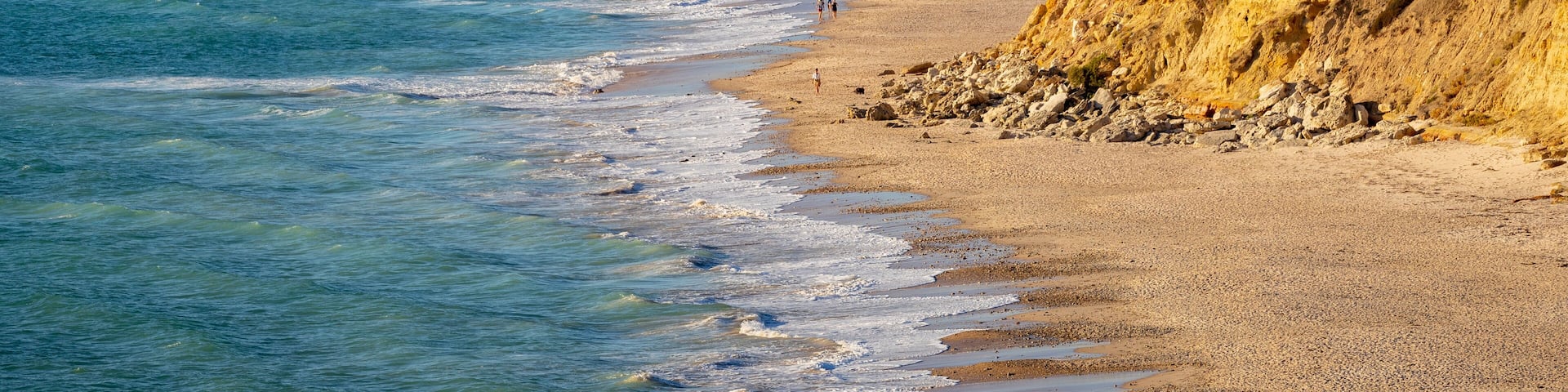 Port Willunga Beach featuring general coastal views, rugged coastline and a sandy beach