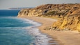 Port Willunga Beach featuring general coastal views, rugged coastline and a sandy beach