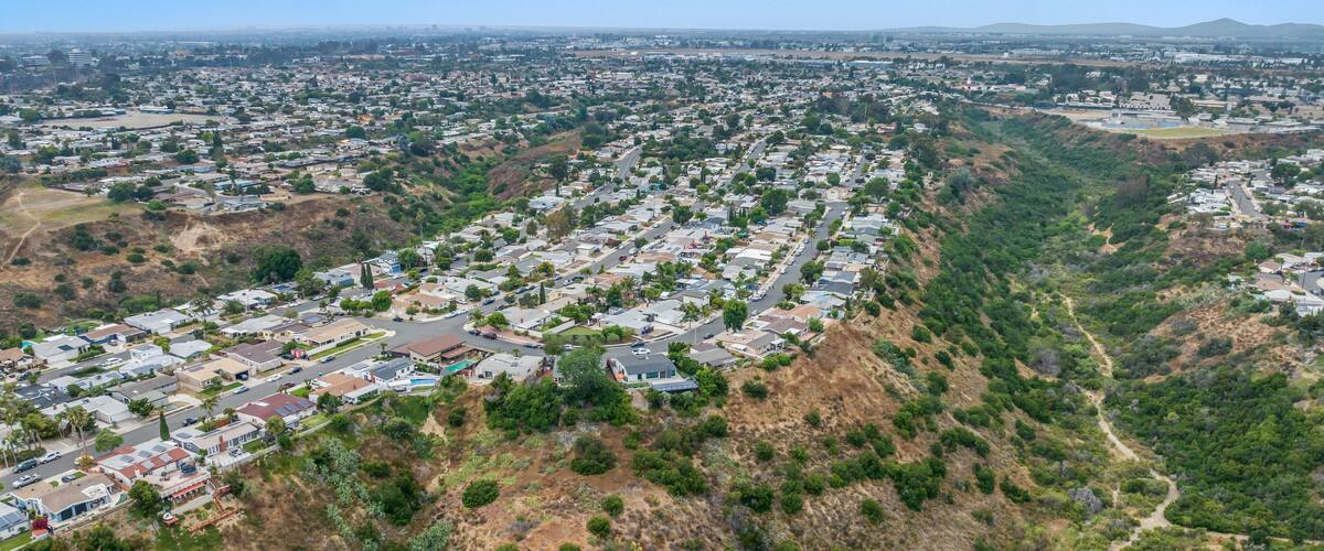 Aerial view of house in Serra Mesa City in San Diego, California, USA. Green Dry Valley and Villas