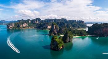 Aerial view Panorama of Ao Nang Island, Rai Lay Beach, Long Bay and passenger boat, tourist, Andaman Sea in the summer season at Krabi Province