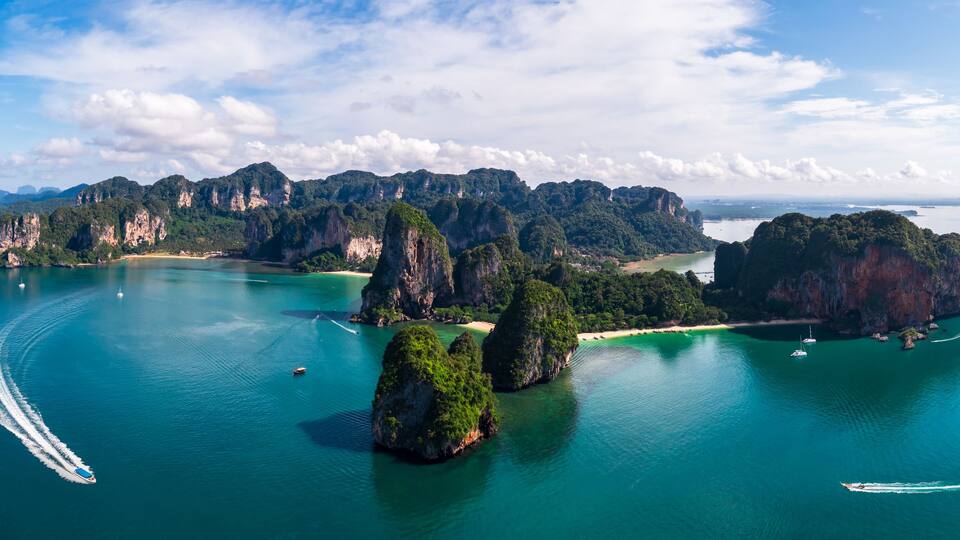 Aerial view Panorama of Ao Nang Island, Rai Lay Beach, Long Bay and passenger boat, tourist, Andaman Sea in the summer season at Krabi Province