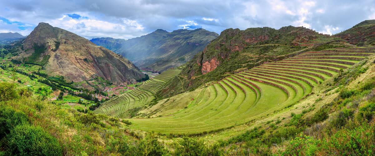 Terraced fields, a valley, and mountains.