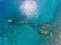 Aerial shot of the Japanese ship wreck with people snorkeling over it. Bali, Indonesia, Shutterstock ID 539406352, Purchase Order: SP-2085, Order Number: SP-2085 Go Guides, Client/Licensee: Hotels.com
