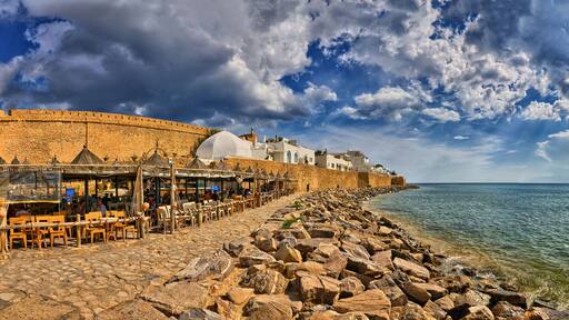 HAMMAMET, TUNISIA - OCT 2014: Cafe on stony beach of ancient Medina on October 6, 2014 in Hammamet, Tunisia