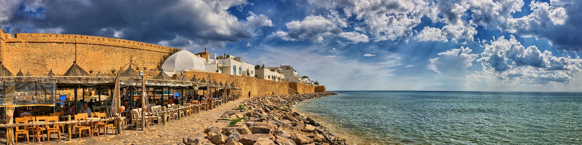 HAMMAMET, TUNISIA - OCT 2014: Cafe on stony beach of ancient Medina on October 6, 2014 in Hammamet, Tunisia