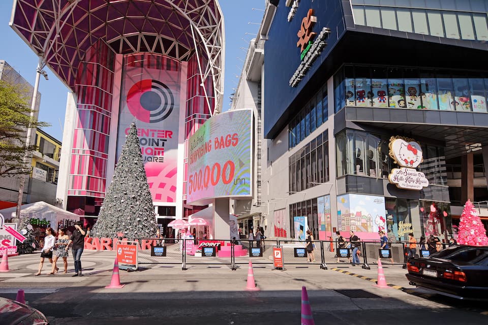 A shopping center with a large Christmas tree, a Target store, and a Hello Kitty House.