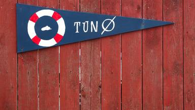 Tuno island sign in Denmark on a wooden wall