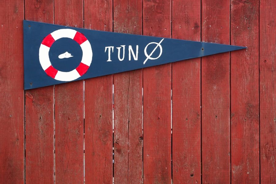 Tuno island sign in Denmark on a wooden wall