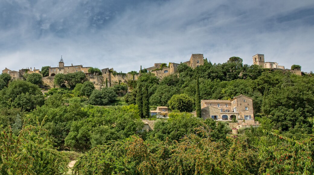 Menerbes Peaceful Village of Provence. View of Ménerbes in early summer with cherry trees, Provence, Luberon, Vaucluse, France