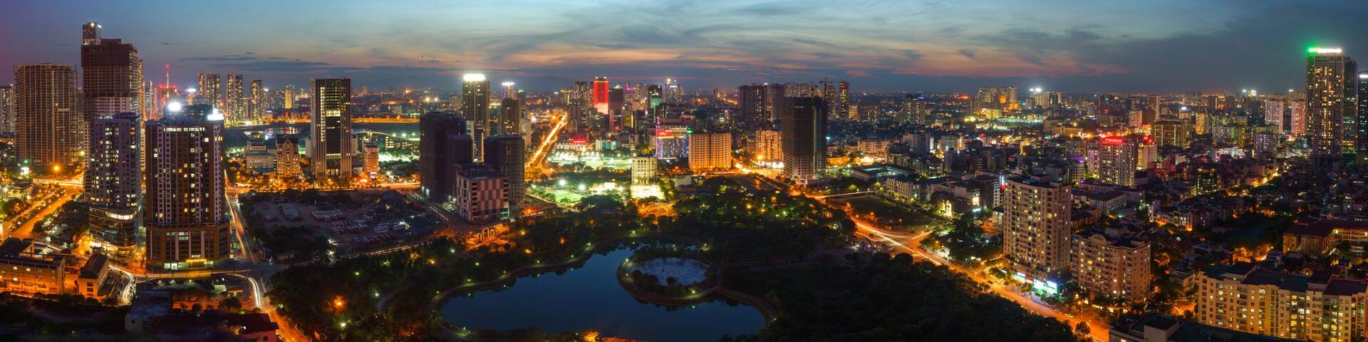 Cityscape of Hanoi skyline at Cau Giay park during sunset time in Hanoi city, Vietnam