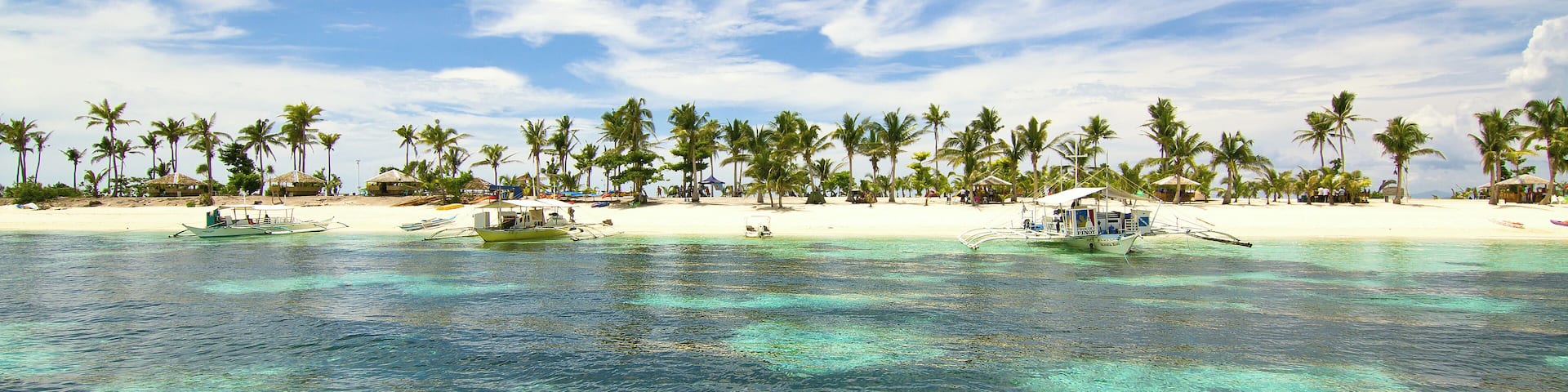 Cerulean skies over turquoise green waters greet us as we approach the pristine beaches of Kalanggaman Island in Palompon, Leyte, Philippines.