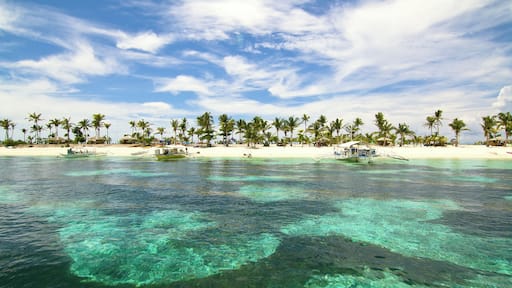 Cerulean skies over turquoise green waters greet us as we approach the pristine beaches of Kalanggaman Island in Palompon, Leyte, Philippines.