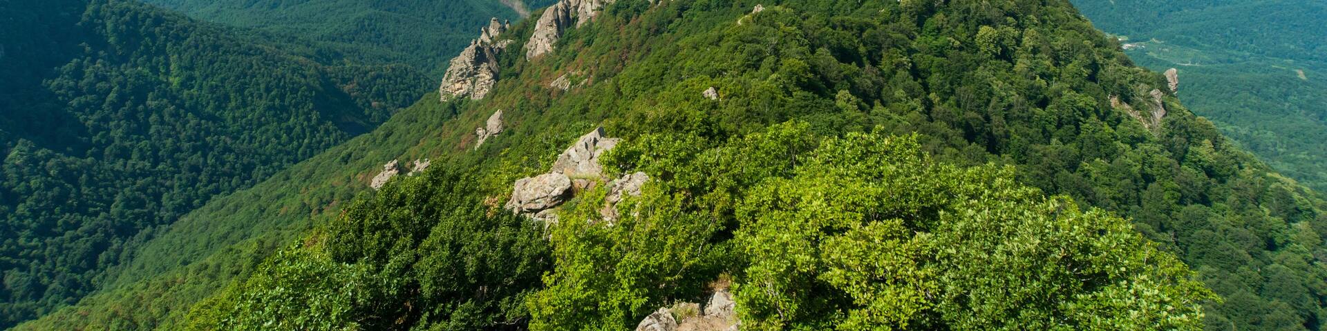 mountain view with a background of bright sun and blue sky. view of Turkey mountain. Russia, Krasnodar territory, Tuapsinsky district