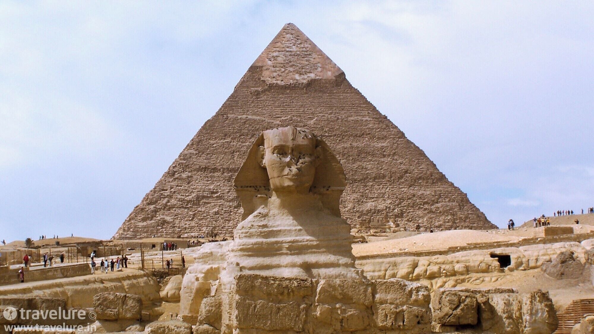 Memphis and its Necropolis – the Pyramid Fields from Giza to Dahshur - that's how the site has been inscribed by UNESCO in its world heritage listing. The great pyramid is 146.5 metres tall while the Sphinx is ~20 metres tall. The pyramids are widely considered to have been built as tombs. While there's no consensus on why this statue of Sphinx was erected, the folklore of Riddle Of Sphinx surely adds some spice to the mystery surrounding it.

#travelure #Sphinx #PyramidOfCheops #Architecture #Cairo #Egypt #RiddleOfSphinx #UNESCO