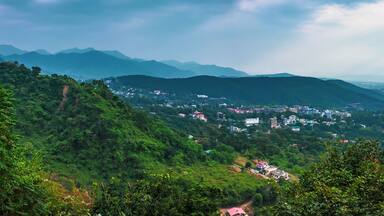 An Aerial landscape view of Mussoorie or Mussouri hill top peak city located in Uttarakhand India with colorful buildings