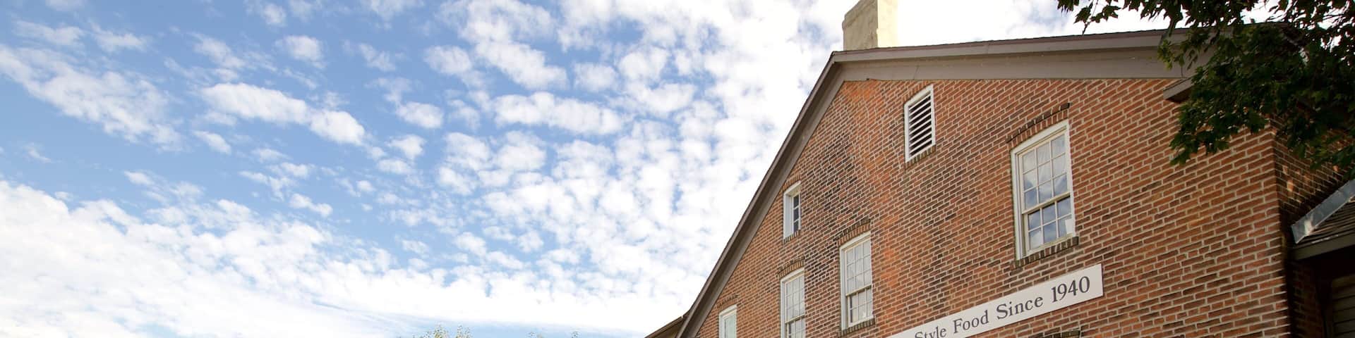 Amana Colonies featuring a small town or village, a house and signage