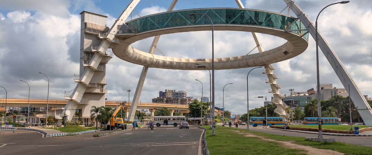 The famous Biswa Bangla Gate, an amusement center at Rajarhat, along with view of morning traffic on the city road at Kolkata, India