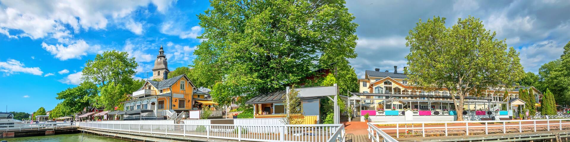 Panoramic cityscape with embankment and marina in Naantali town at sunny summer day. Finland