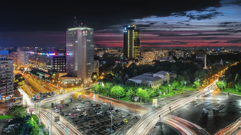 Aerial view of the business district in the Victoria Square. Night lights after a storm, sunset in Bucharest, Romania.