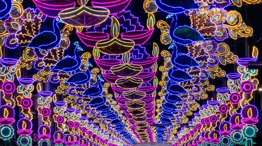 View of colourful Deepavali street lights and decorations with a vibrant crowd, Serangoon Road, Singapore.