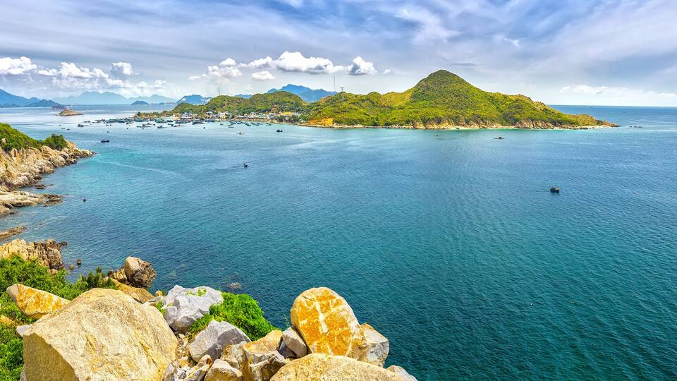 Beautiful panoramic landscape of Vietnam beach at Vinh Hy, Ninh Thuan, road along beach, small island, waves make, fresh air make fantastic holiday when travel at Viet Nam in summer or spring
