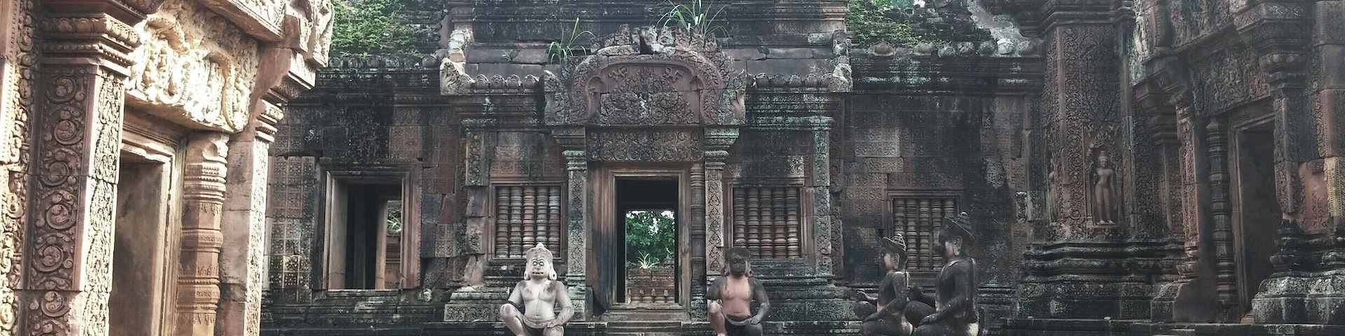 Banteay Srei, pink sandstone with elaborate carvings that adorn the doorways and walls.