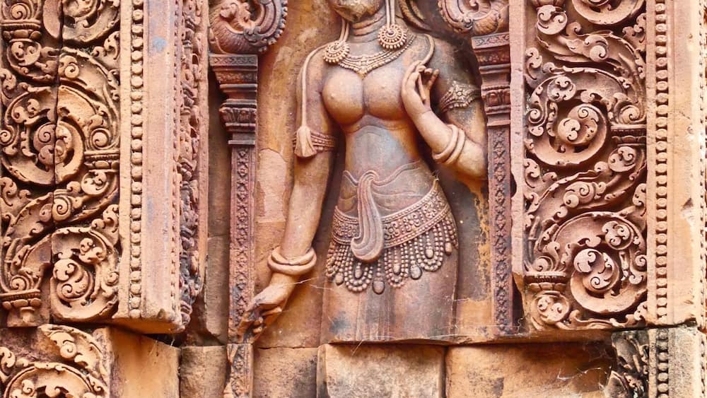 Beautiful Apsara at the pink temple. Time your visit early or late to avoid masses of tour buses.