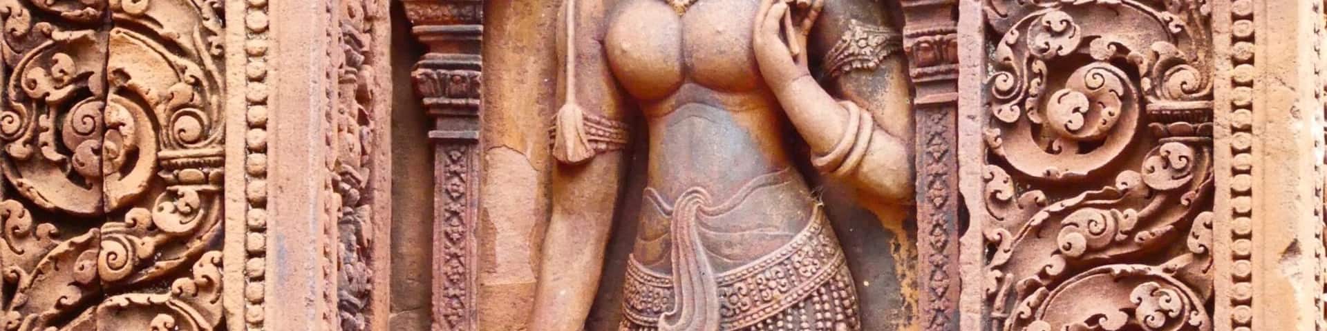 Beautiful Apsara at the pink temple. Time your visit early or late to avoid masses of tour buses.