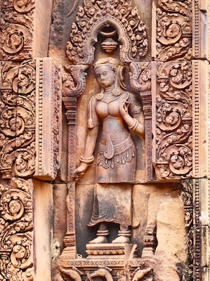 Beautiful Apsara at the pink temple. Time your visit early or late to avoid masses of tour buses.