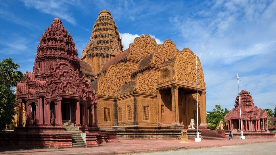 A large, intricately carved temple with multiple spires and detailed architecture.