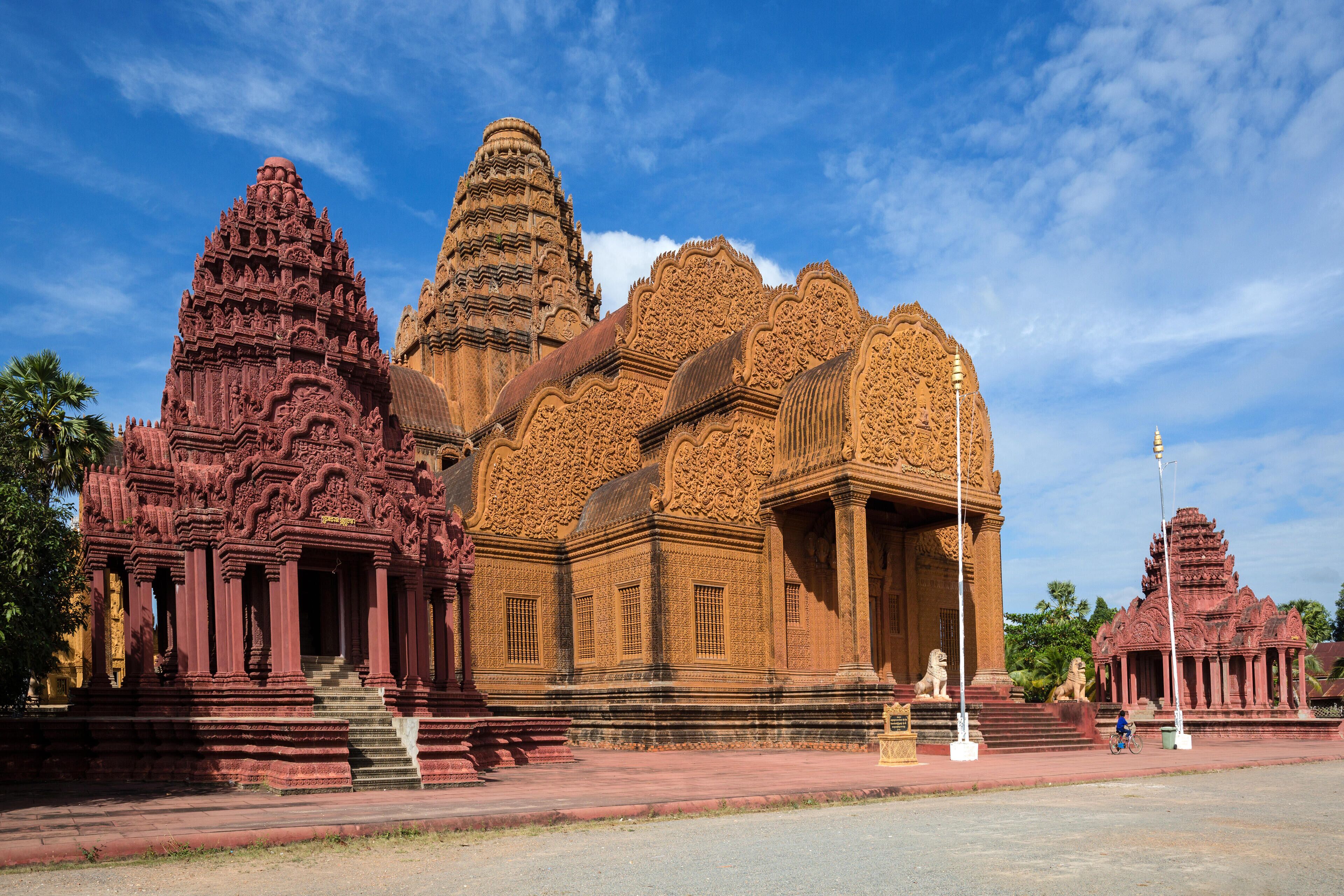 A large, intricately carved temple with multiple spires and detailed architecture.