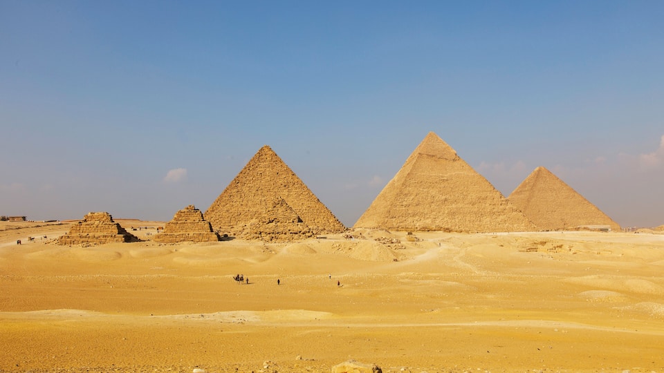Egypt. Cairo - Giza. General view of pyramids from the Giza Plateau (on front side 3 pyramids popularly known as Queens' Pyramids; next: the Pyramid of Mykerinos, Chephren and Cheops)