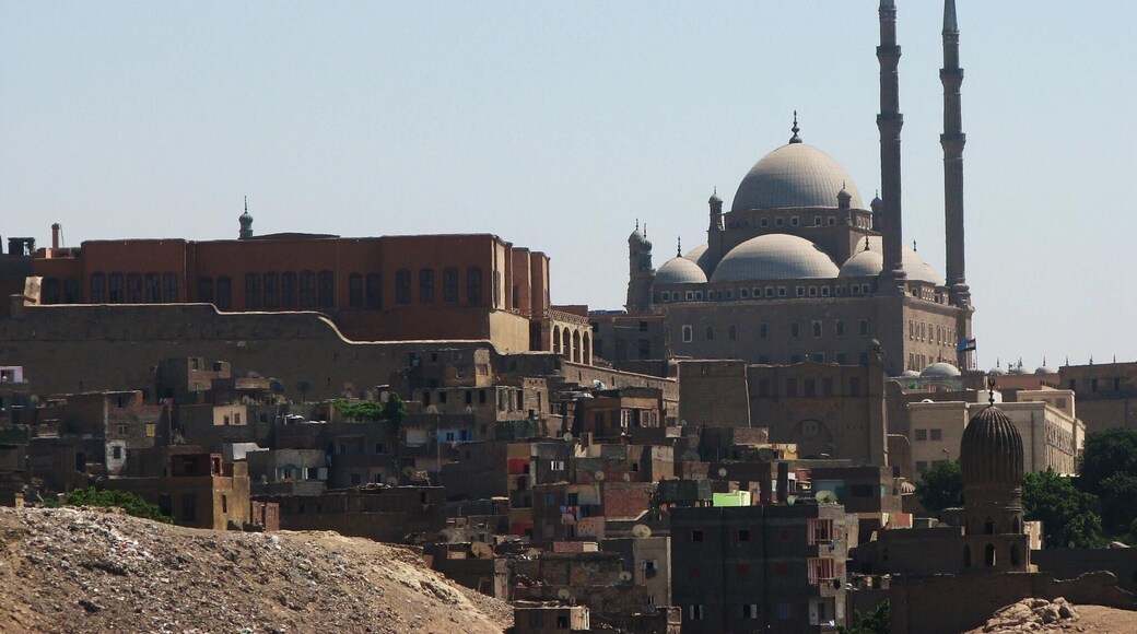 The Citadel of the Mountain (Qal‘at al-Jabal) in Cairo is one of the major works of military architecture of the middle ages. Situated on a spur that was artificially cut out of the Muqattam Hills, the Citadel dominates the city of Cairo and turns its back to the rocky hills and the desert behind. Founded by Salah al-Din al-Ayyubi (Saladin) in 1176 AD, the Citadel was a sign of the coming of a new regime whose roots were foreign and tastes were military. For almost seven centuries (1206-1874 AD), it was the seat of government for the Ayyubids (1171-1250 AD), Mamluks (1250-1516 AD), Ottomans (1516-1798 AD), and the Muhammad ‘Ali Family (1798-1952 AD), as well as a real and symbolic barrier between the rulers and the ruled. During this long period, it was the stage upon which the history of Egypt was played out.