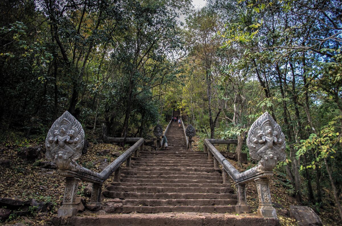 Built in the 10th century on the top of a hill, the temple is reachable by climbing a long flight of steps. Like in many of the temples in Angkor, there’s a coexistence of Hindu and Buddhist elements and it reminds, in a much smaller scale, the majestic Angkor Wat. The most scenic part, in my opinion, is the stairs. The 370 steps are framed by lushy trees that offer shade during your hike and it steep verticality, drag your eyes to the top temple.

http://nomadswind.com/cambodia-travel-diary-2-battambang-2/