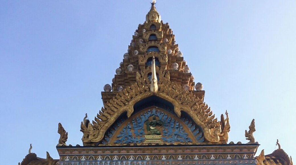 If you continue up the hill from the Killing Caves, you will find the temple that has been built in recent years thanks to donation from Khmer people.
The temple is nice and colorful with some monkeys hanging around, but the best part is the view: you can see the green countryside surrounded by the mountain at the horizont. http://nomadswind.com/cambodia-travel-diary-2-battambang-2/