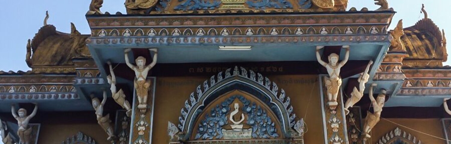 If you continue up the hill from the Killing Caves, you will find the temple that has been built in recent years thanks to donation from Khmer people.
The temple is nice and colorful with some monkeys hanging around, but the best part is the view: you can see the green countryside surrounded by the mountain at the horizont. http://nomadswind.com/cambodia-travel-diary-2-battambang-2/